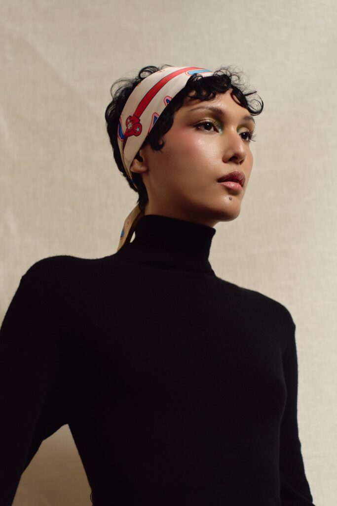 Model wearing the Sword skinny scarf as a headband